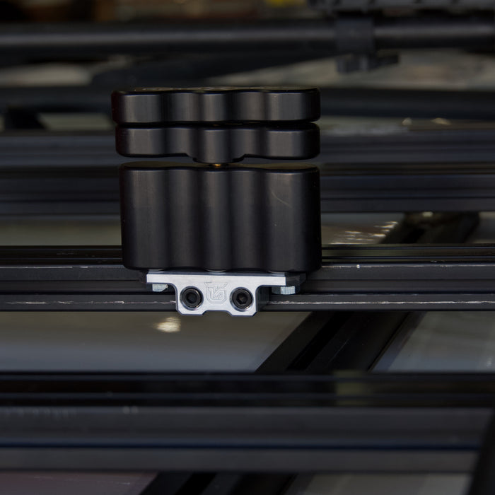 Rotopax mount adapter for extrusion roof rack cross bars.